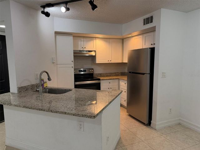 4658 COMMANDER DRIVE 813, Orlando, FL 32822