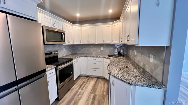 421 Weymouth Court D, Ridge, NY 11961