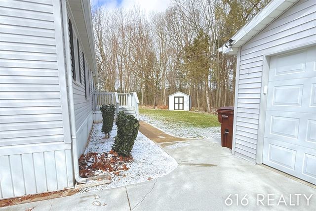 7358 Willow Wood Drive, Belmont, MI 49306