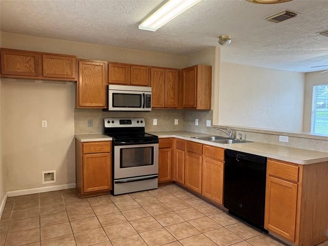 14129 Broken Arrow Drive, Willis, TX 77378