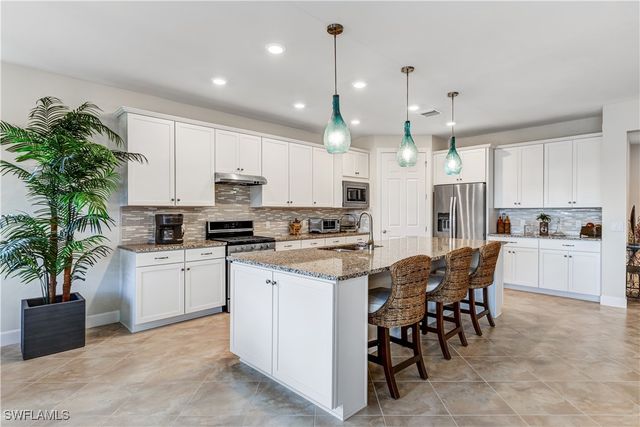 7611 Winding Cypress DR, Naples, FL 34114