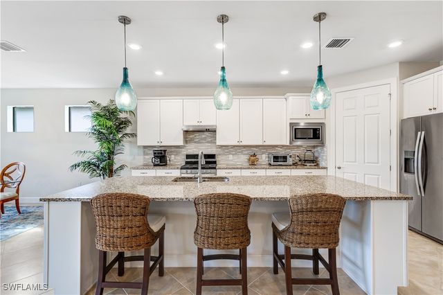 7611 Winding Cypress DR, Naples, FL 34114