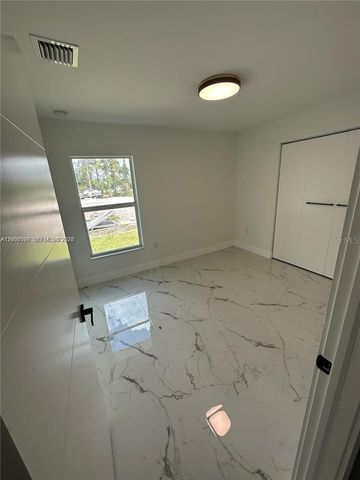 1125 MILWAUKEE BOULEVARD, Lehigh Acres, FL 33974