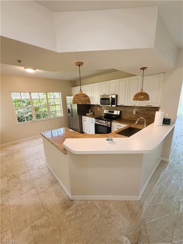 7518 Silver Trumpet LN 101, Naples, FL 34109