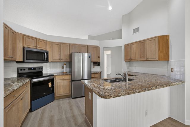 103 Oxford Court, Royal Palm Beach, FL 33411