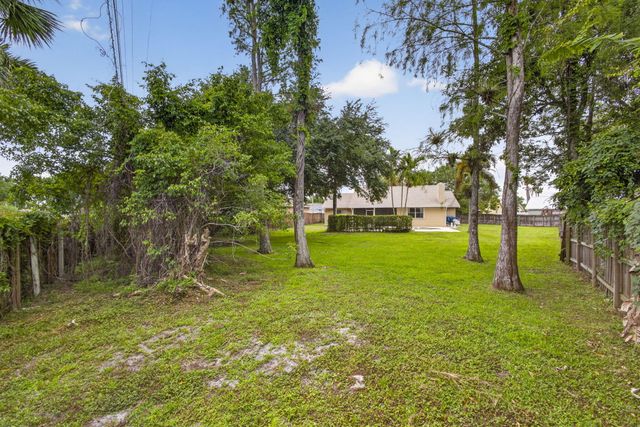 103 Oxford Court, Royal Palm Beach, FL 33411