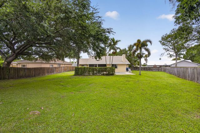 103 Oxford Court, Royal Palm Beach, FL 33411