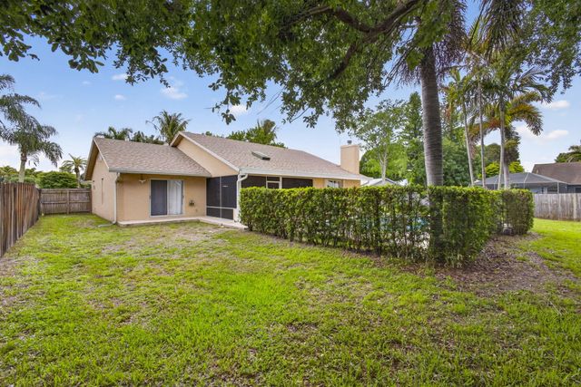 103 Oxford Court, Royal Palm Beach, FL 33411