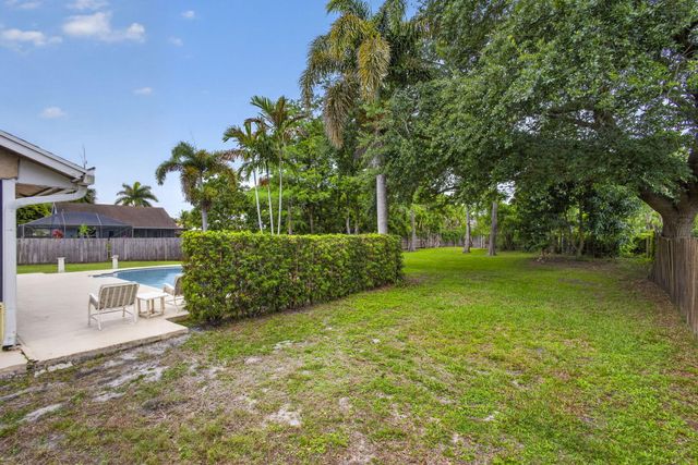 103 Oxford Court, Royal Palm Beach, FL 33411