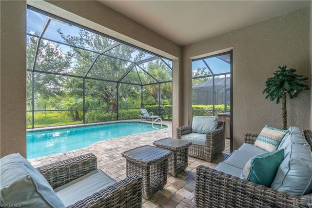7473 Winding Cypress DR, Naples, FL 34114