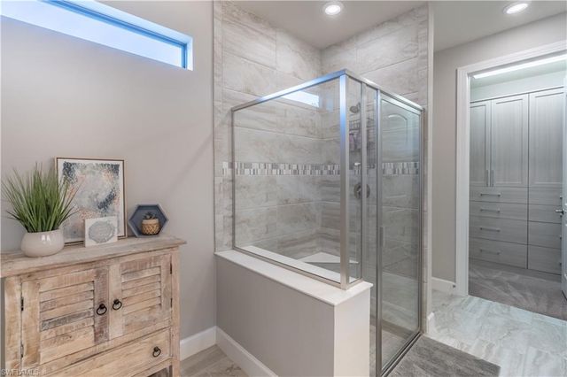 7473 Winding Cypress DR, Naples, FL 34114