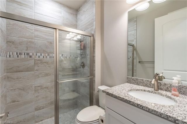 7473 Winding Cypress DR, Naples, FL 34114