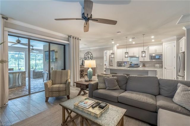 7473 Winding Cypress DR, Naples, FL 34114
