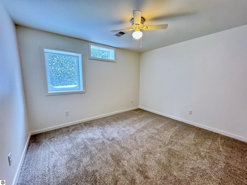 Image 13 of property listing at 5260 W Blair Townhall Road, Grawn, MI 49637