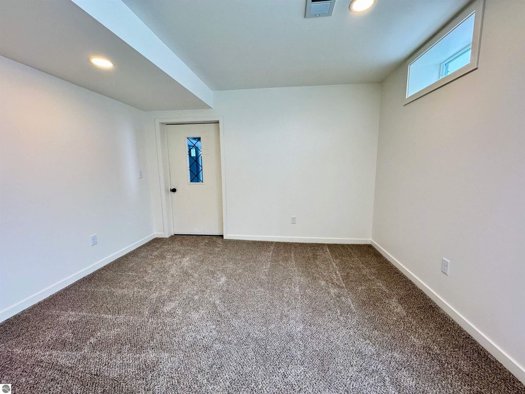 Image 14 of property listing at 5260 W Blair Townhall Road, Grawn, MI 49637