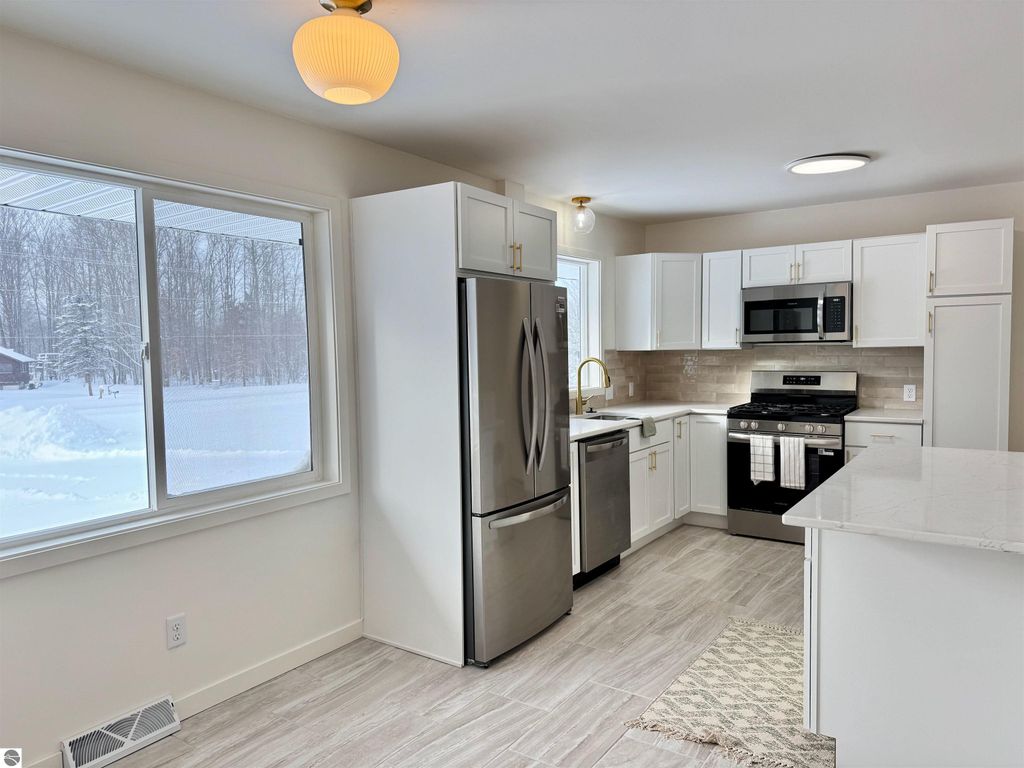 Image 20 of property listing at 5260 W Blair Townhall Road, Grawn, MI 49637