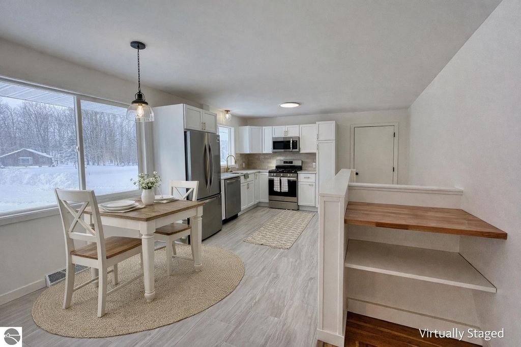 Image 21 of property listing at 5260 W Blair Townhall Road, Grawn, MI 49637