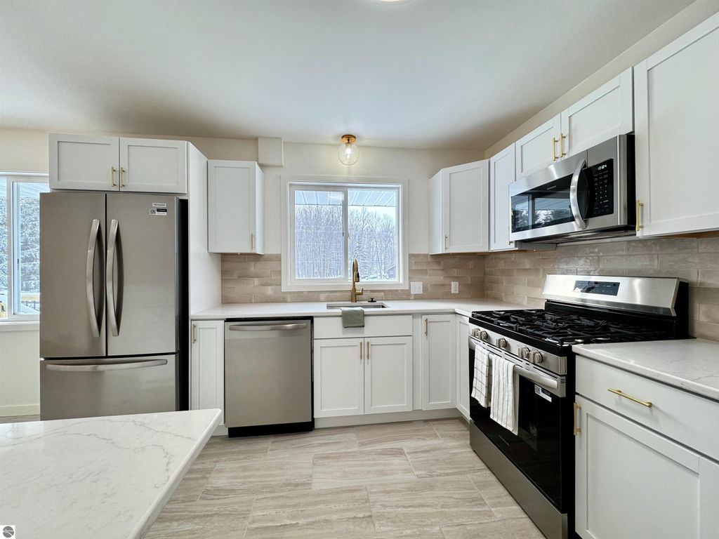 Image 22 of property listing at 5260 W Blair Townhall Road, Grawn, MI 49637