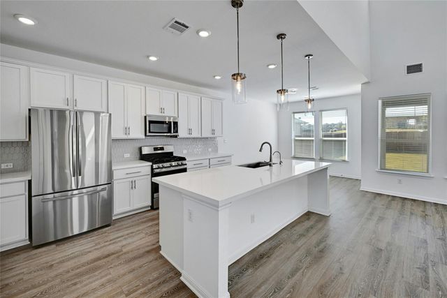 6411 Velvet Leaf LN, Buda, TX 78610