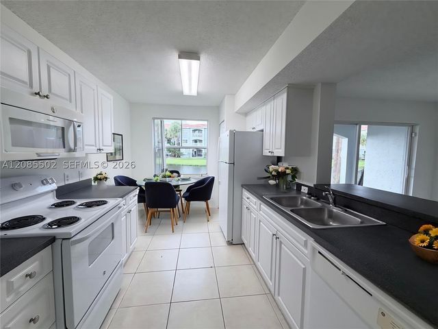 9645 NW 1st Ct 1-110, Pembroke Pines, FL 33024