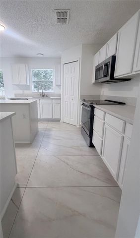 1637 MYRTLE LAKE AVENUE, Fruitland Park, FL 34731