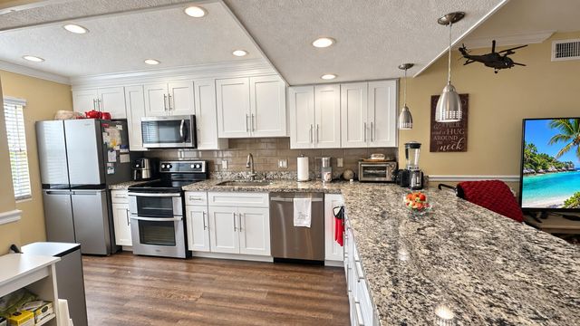 14 COLONIAL CLUB Drive 103, Boynton Beach, FL 33435