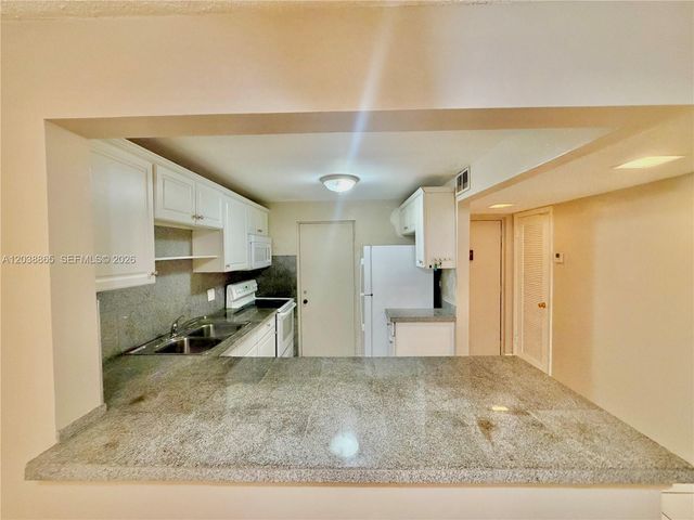 2320 S Cypress Bend Drive 206, Pompano Beach, FL 33069