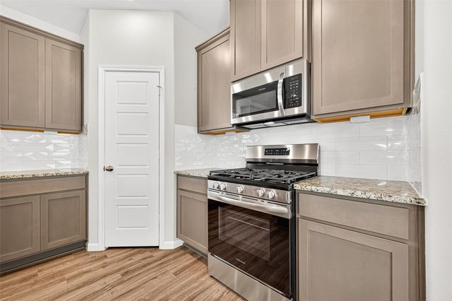 9987 Enclave Grove Drive, Willis, TX 77318