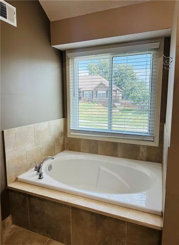 208 N Pacific Court, Raymore, MO 64083