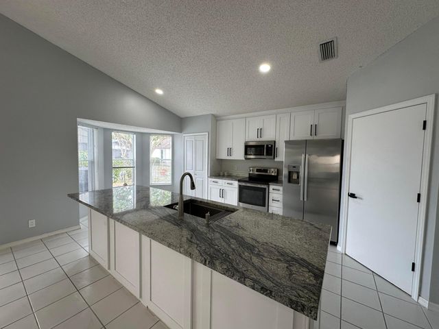 119 Hammocks Court, Greenacres, FL 33413