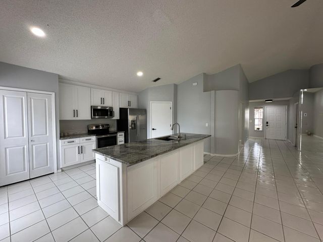 119 Hammocks Court, Greenacres, FL 33413