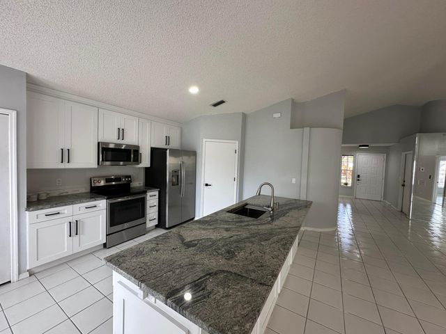 119 Hammocks Court, Greenacres, FL 33413