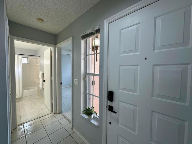 119 Hammocks Court, Greenacres, FL 33413