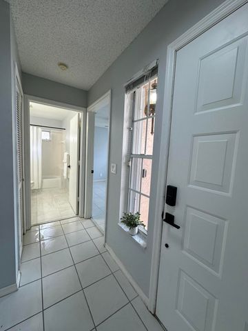 119 Hammocks Court, Greenacres, FL 33413