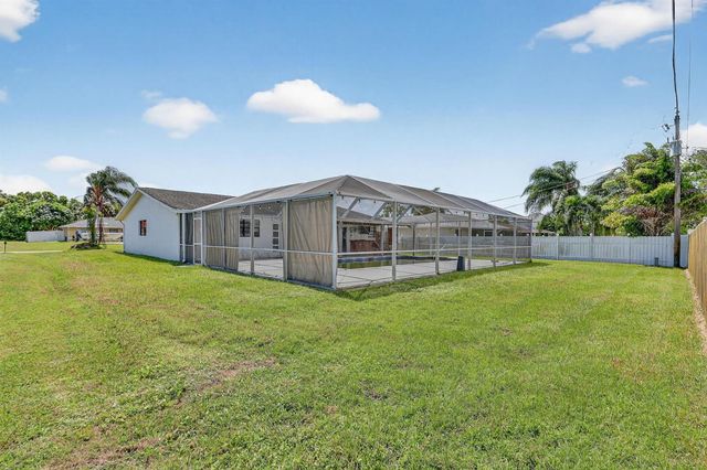 143 SW Grove Avenue, Port St. Lucie, FL 34983