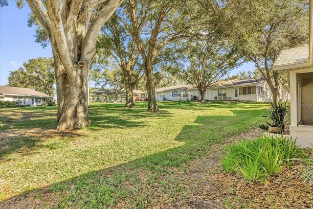 9028 VILLAGE GREEN BOULEVARD, Clermont, FL 34711