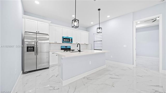 1210 CLAYTON AVE, Lehigh Acres, FL 33972