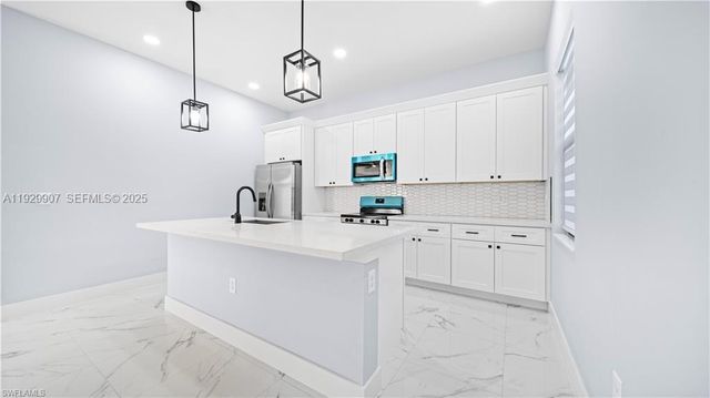 1210 CLAYTON AVE, Lehigh Acres, FL 33972