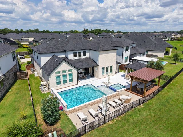 25003 Rainflower Creek Lane, Tomball, TX 77375