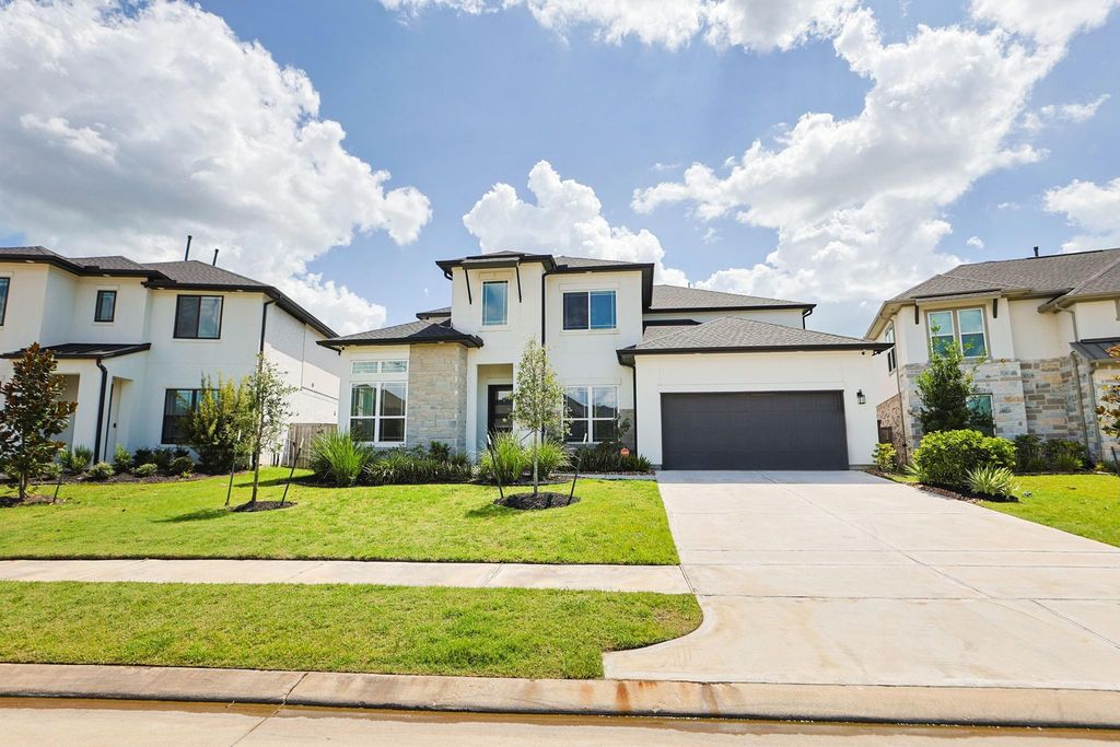 25003 Rainflower Creek Lane, Tomball, TX 77375