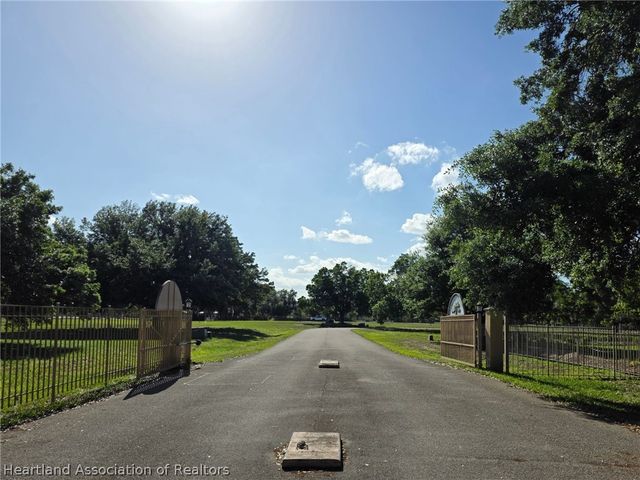 1048 Whispering Oaks Court, Sebring, FL 33875