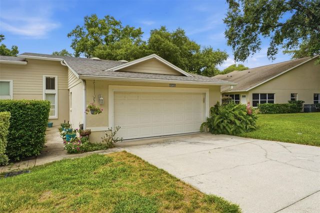 8928 VILLAGE GREEN BOULEVARD, Clermont, FL 34711