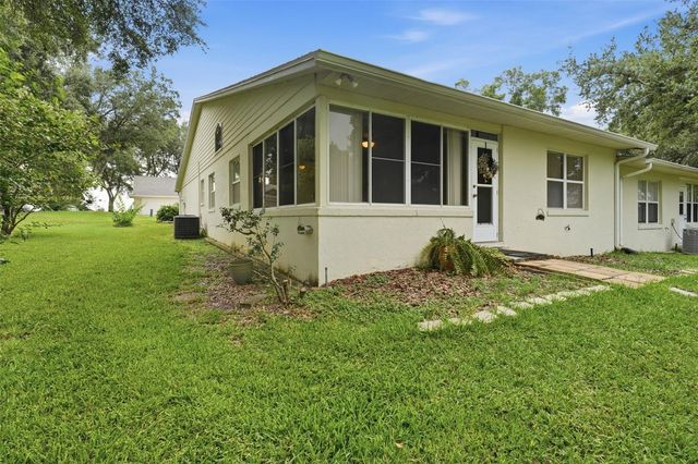 8928 VILLAGE GREEN BOULEVARD, Clermont, FL 34711
