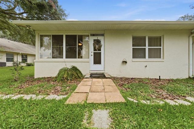 8928 VILLAGE GREEN BOULEVARD, Clermont, FL 34711
