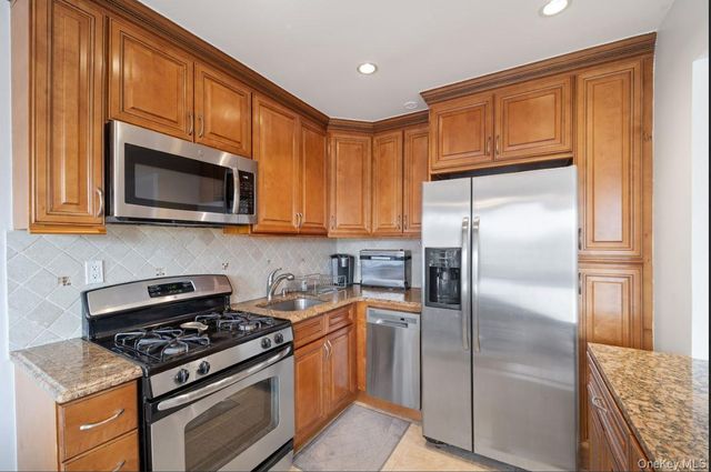 6923 66th Drive, Middle Village, NY 11379