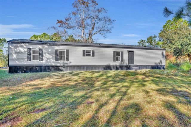 6180 WINNING WOOD TRAIL, De Leon Springs, FL 32130
