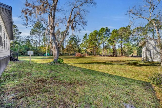 6180 WINNING WOOD TRAIL, De Leon Springs, FL 32130