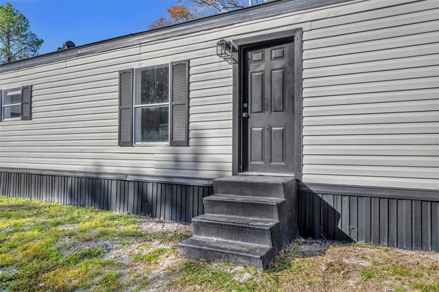 6180 WINNING WOOD TRAIL, De Leon Springs, FL 32130