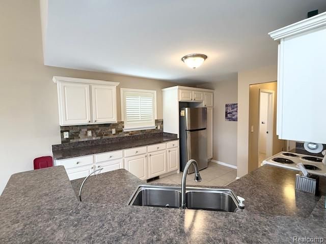 27992 Tremonte Drive 12, New Hudson, MI 48165