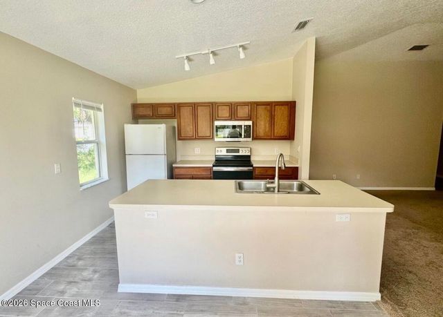 1072 Flintlock Avenue SE, Palm Bay, FL 32909